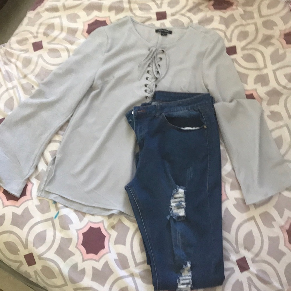 Casual grey blouse and Blue jeans with torn style